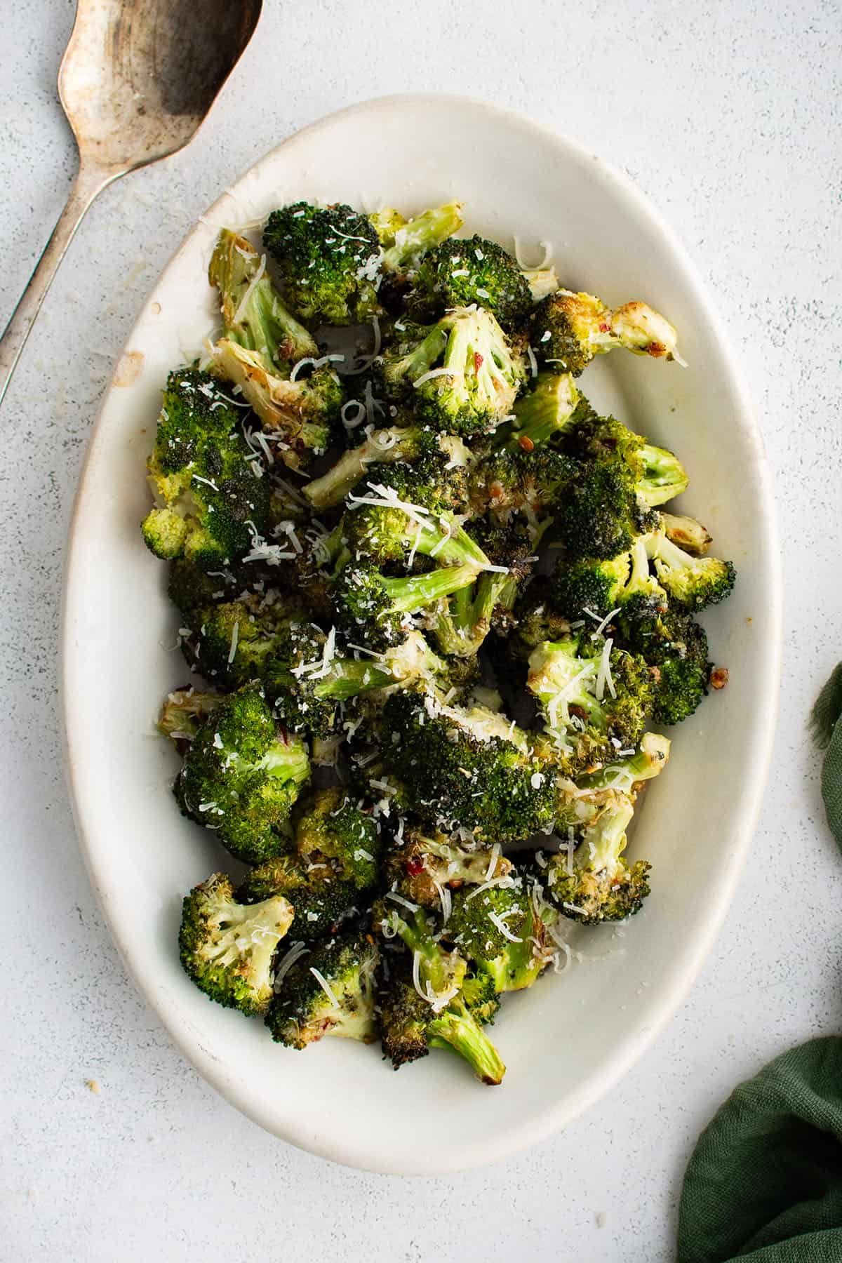 baked broccoli with parmesan ranch on a serving plate