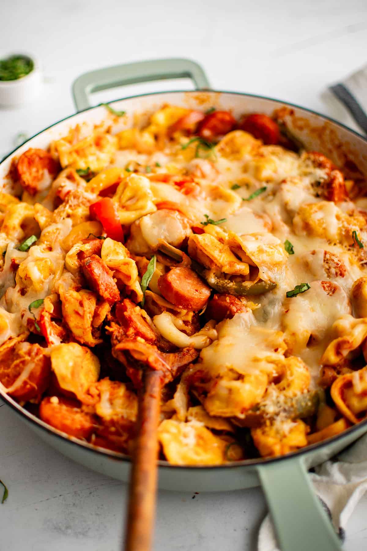 tortellini in a skillet cooked with sausage