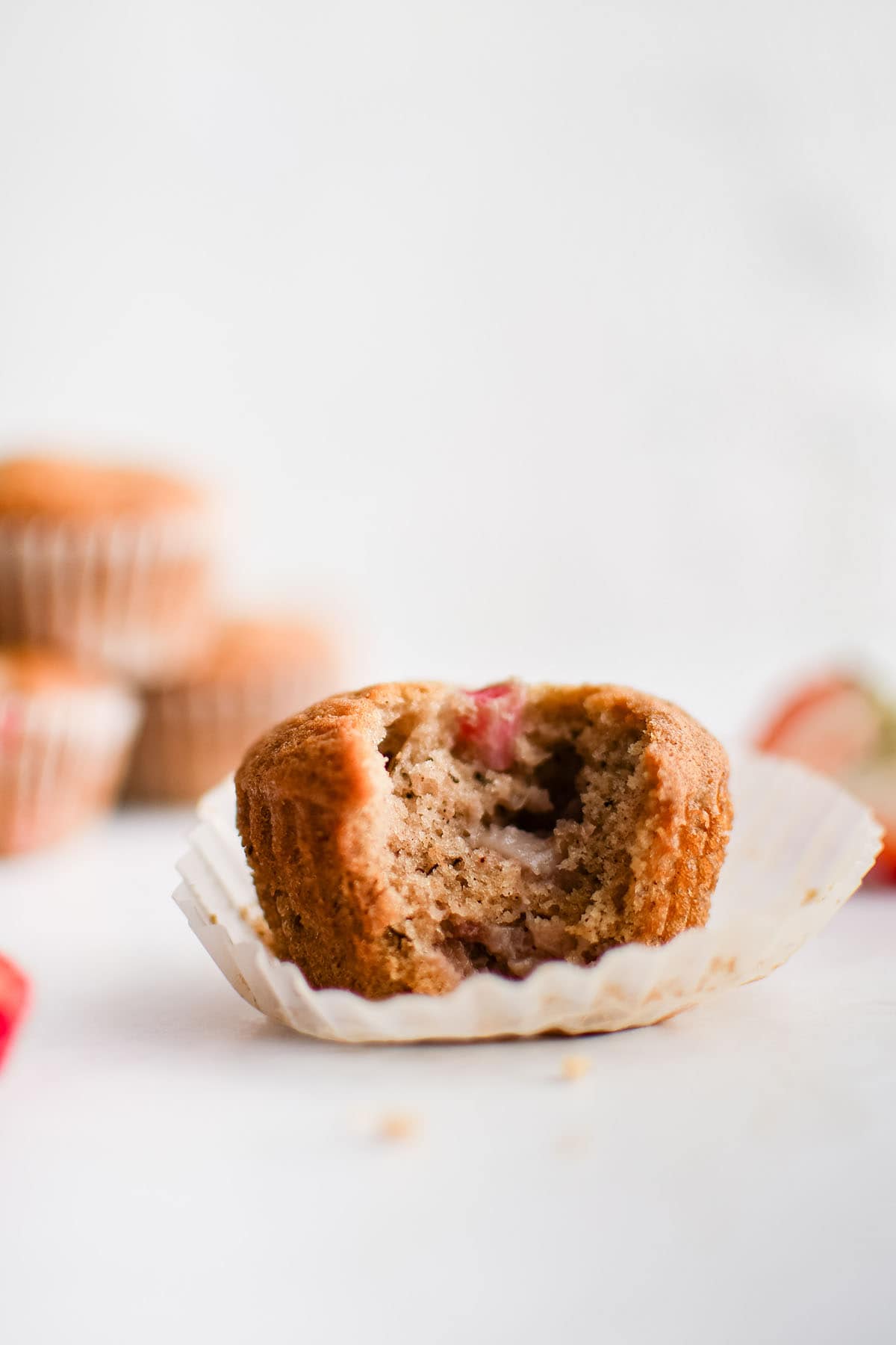strawberry banana muffin on a muffin liner