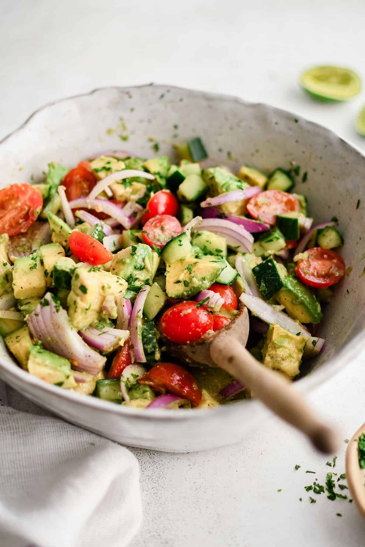 avocado salad with tomatoes and onions in a bowl