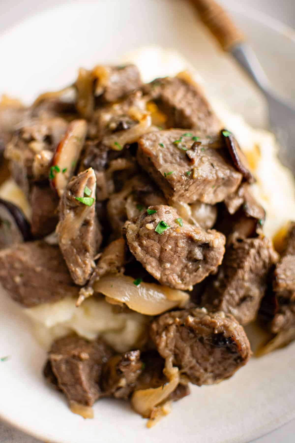 french onion steak bites on a plate