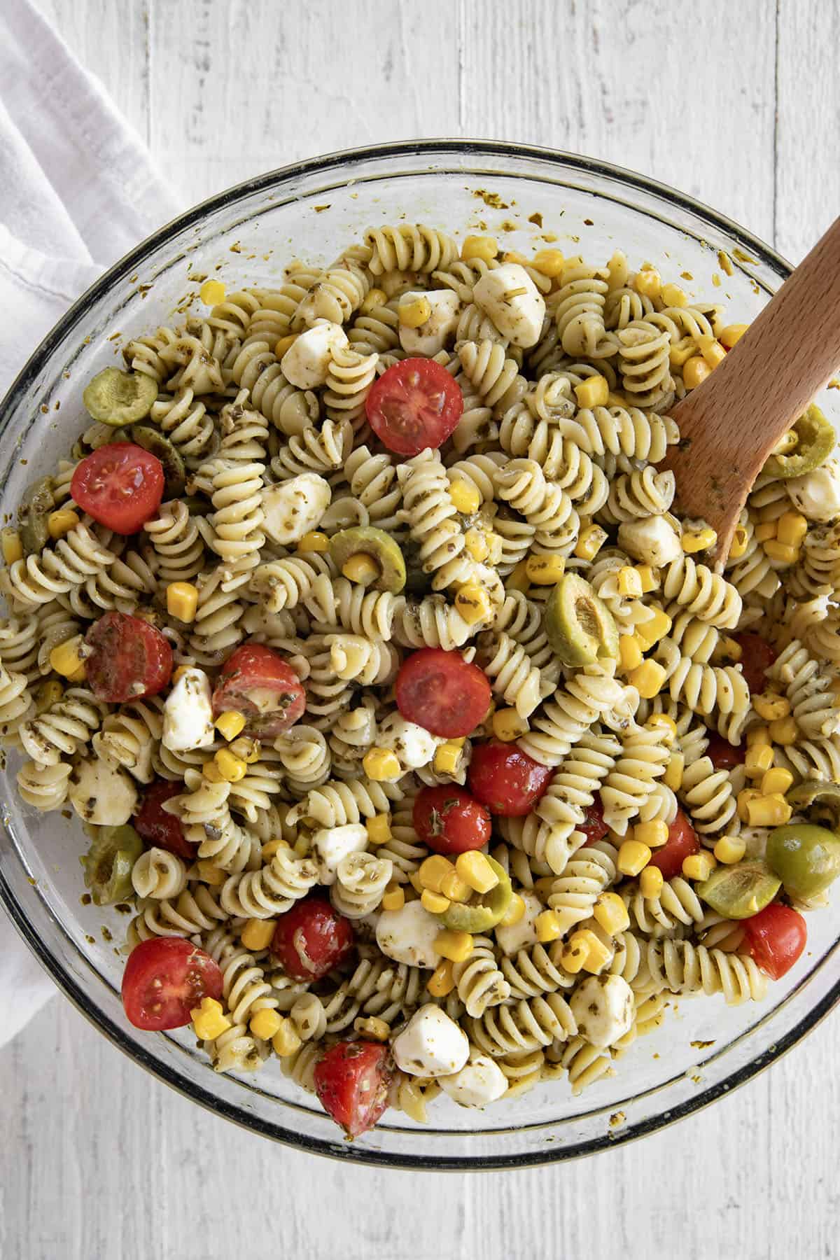 buttermilk pesto pasta salad in a serving bowl