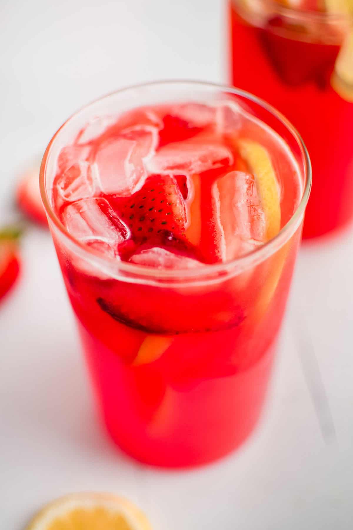 strawberry lemonade in a glass with ice