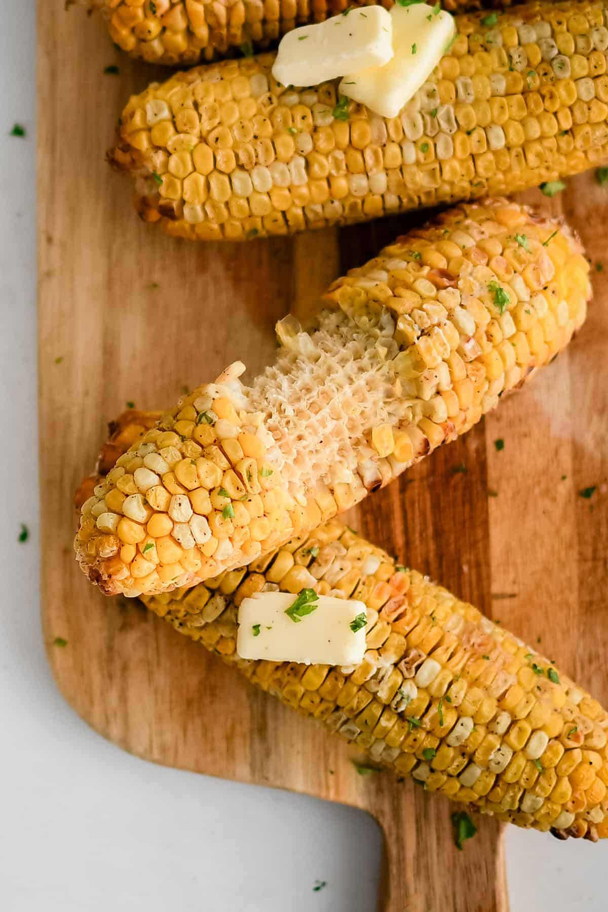 air fryer corn on the cob on a serving dish