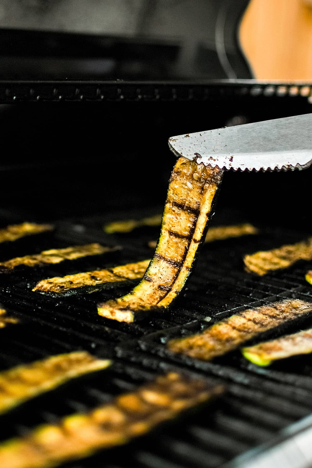 photo of grilled zucchini on the grill