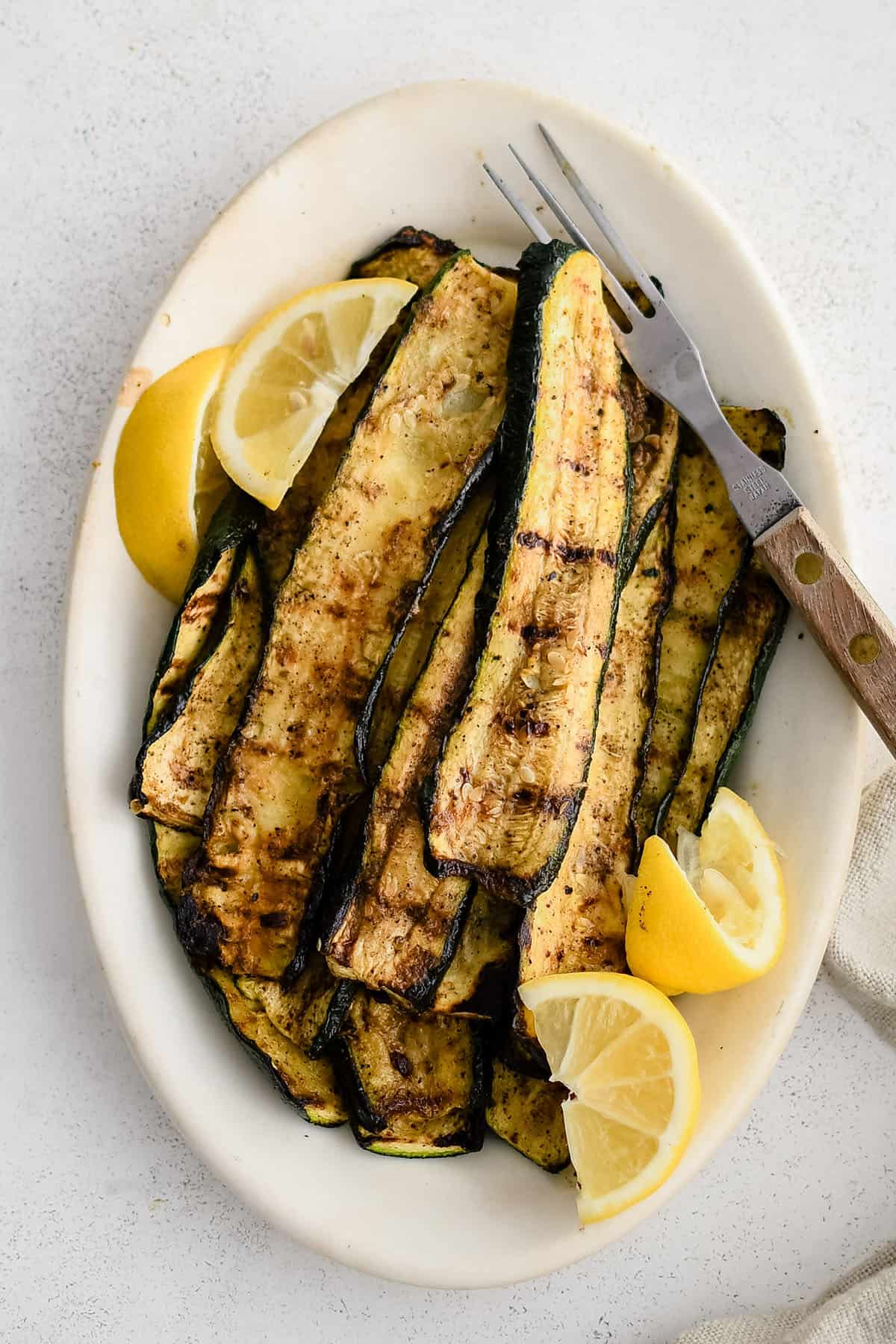 grilled zucchini in a serving dish