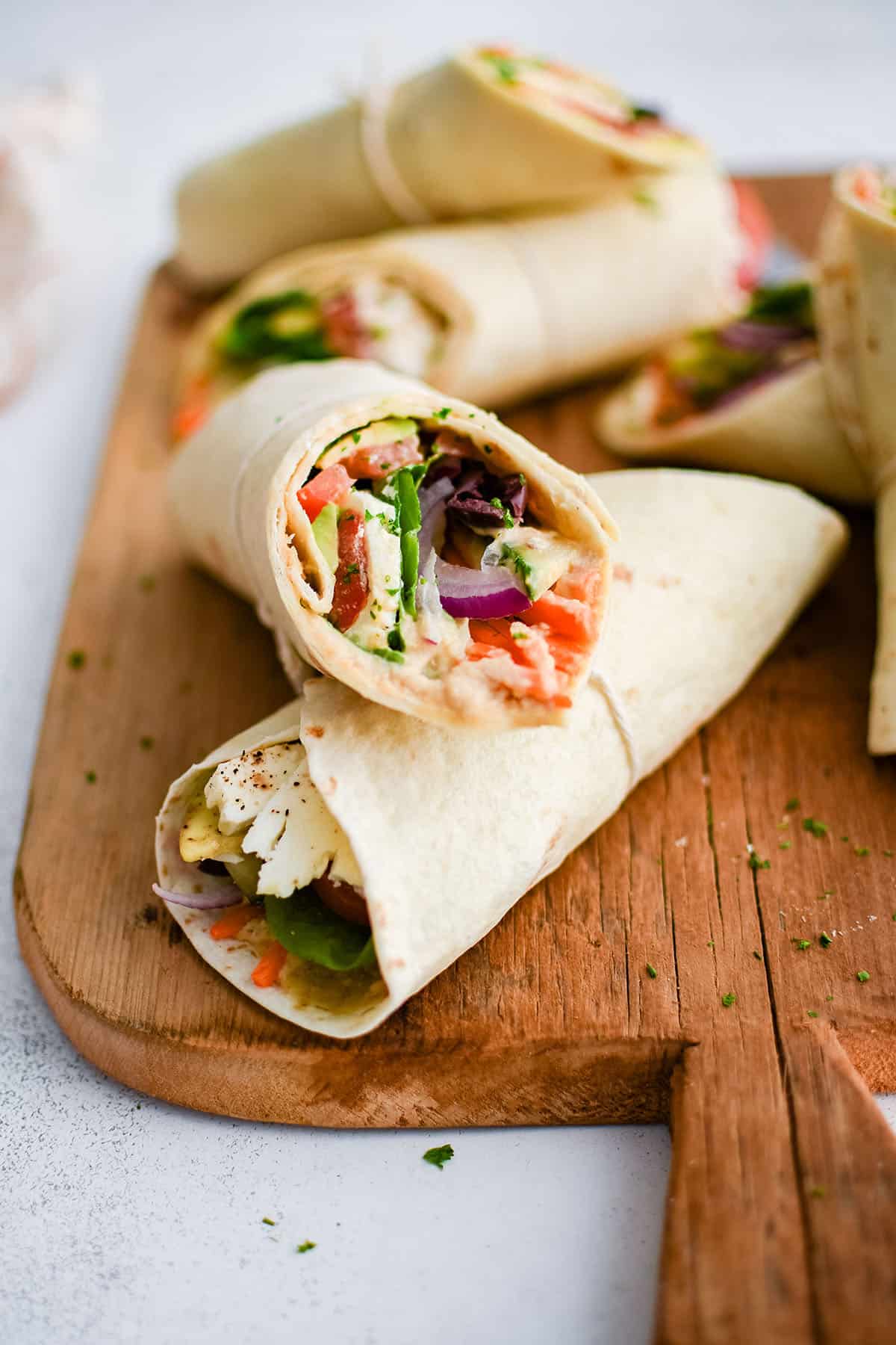 veggie wraps on a cutting board