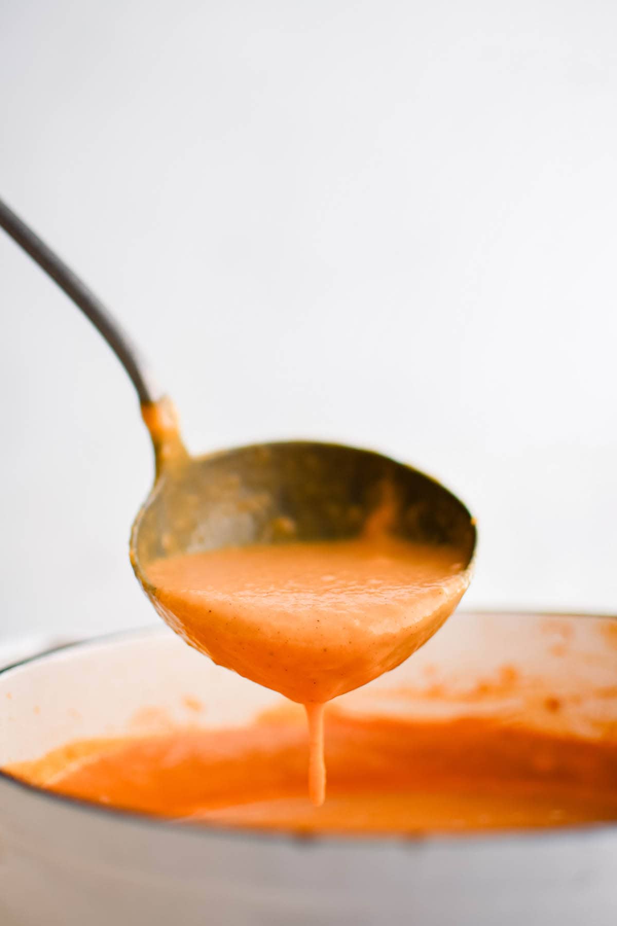 sweet potato soup in a ladle