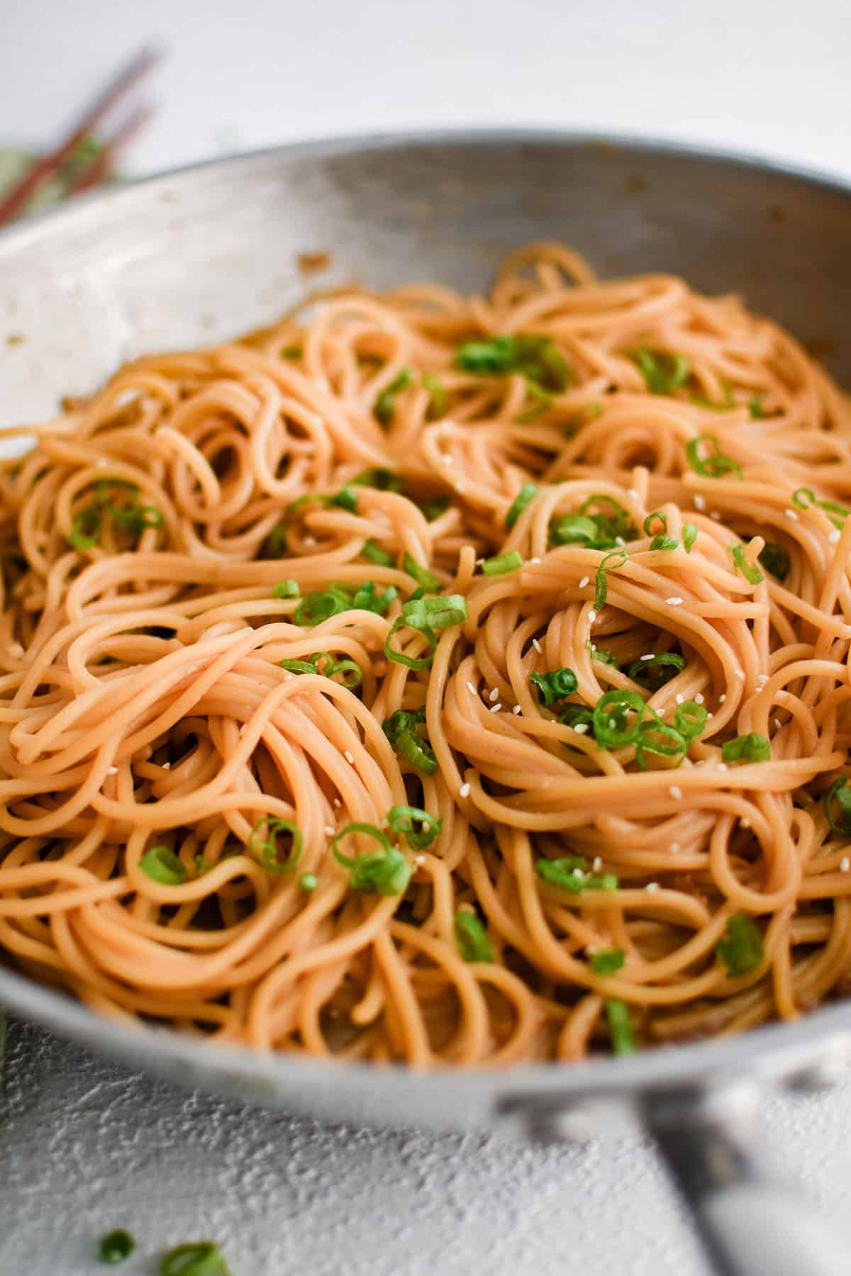 noodles with teriyaki sauce in a pan