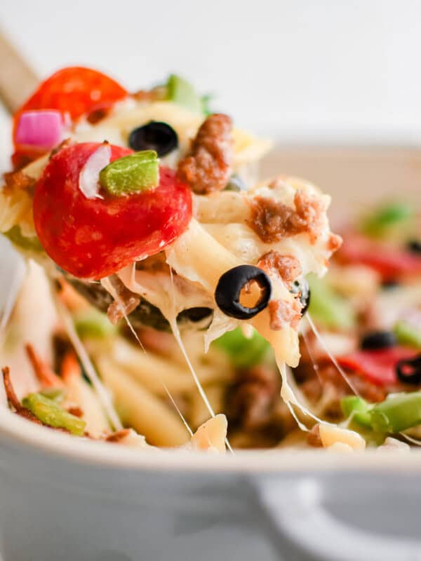 white pizza pasta bake in a pan with a spoon