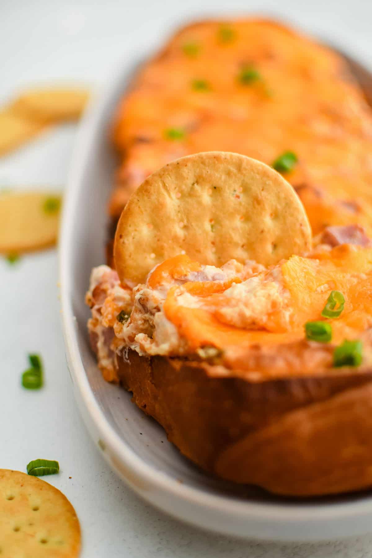 Mississippi Sin Dip with a cracker dipped into it