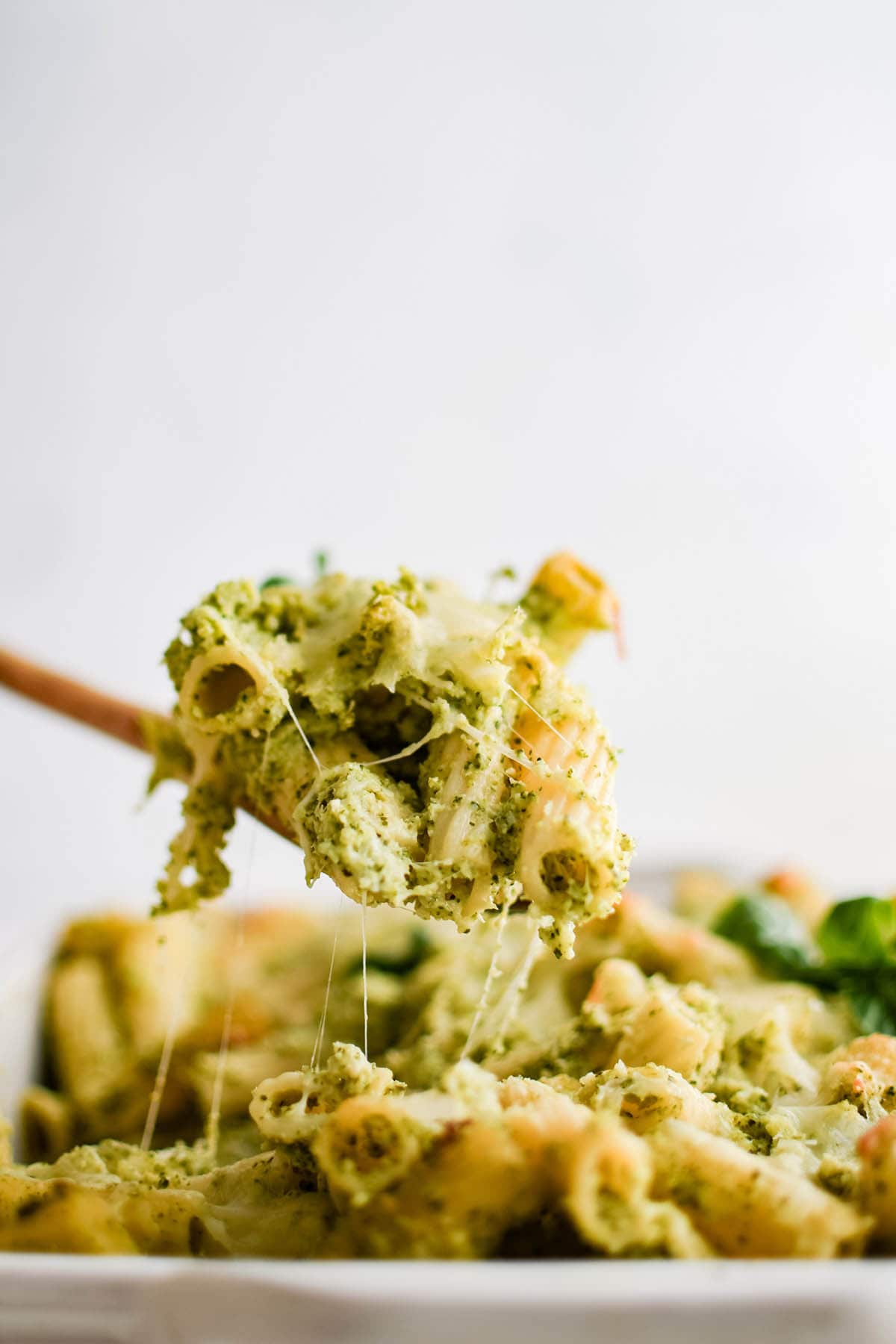 winter broccoli pesto baked pasta on a serving spoon