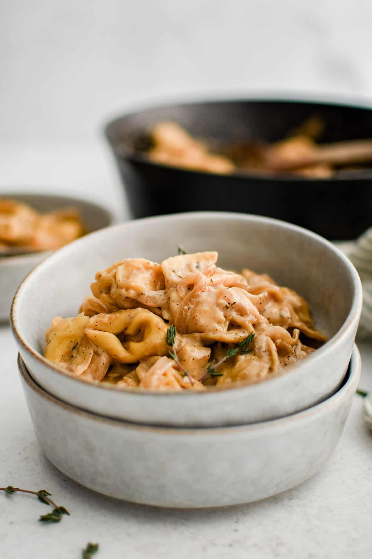 creamy french onion tortellini recipe in a white bowl