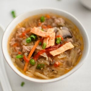 image of egg roll soup in a white bowl