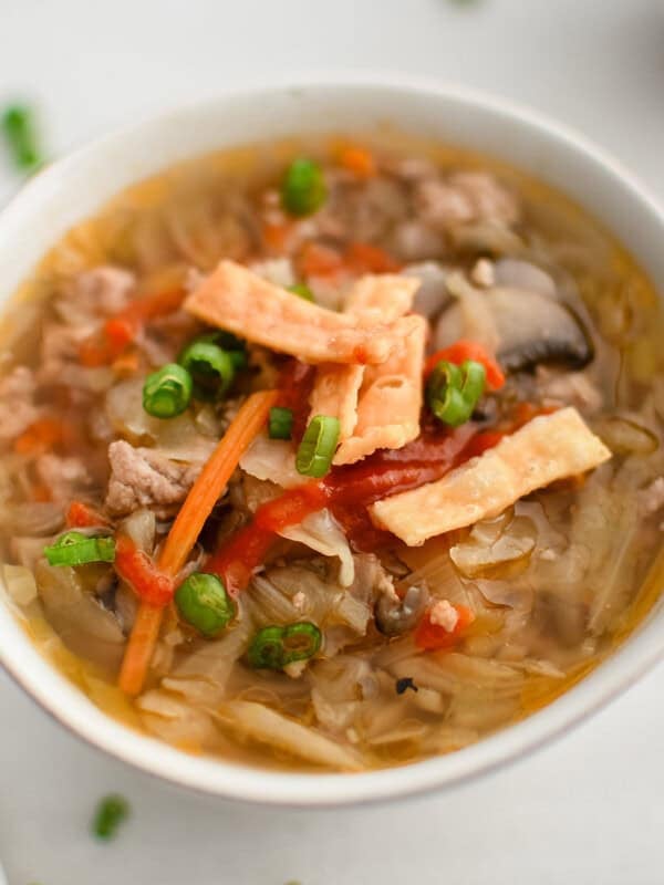 image of egg roll soup in a white bowl