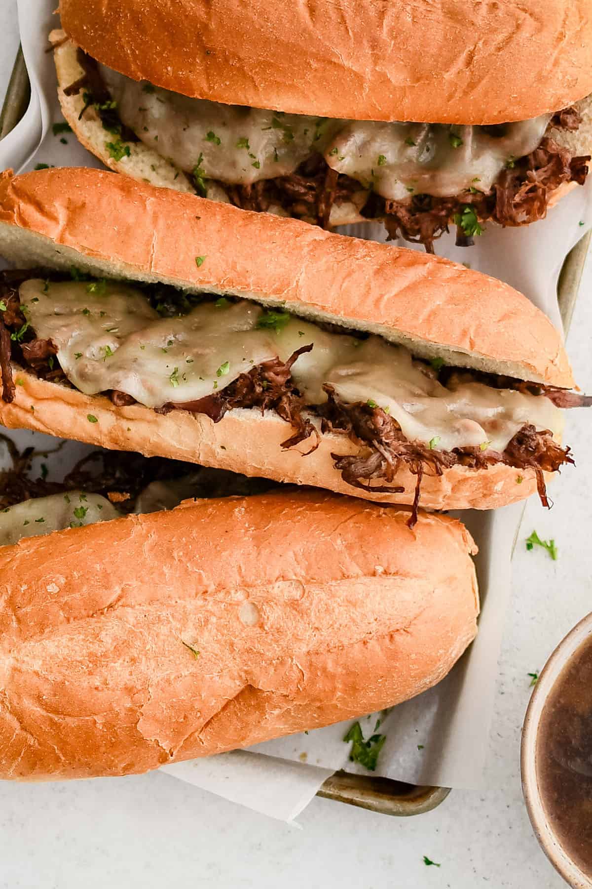 photo of french dip sandwiches on a plate