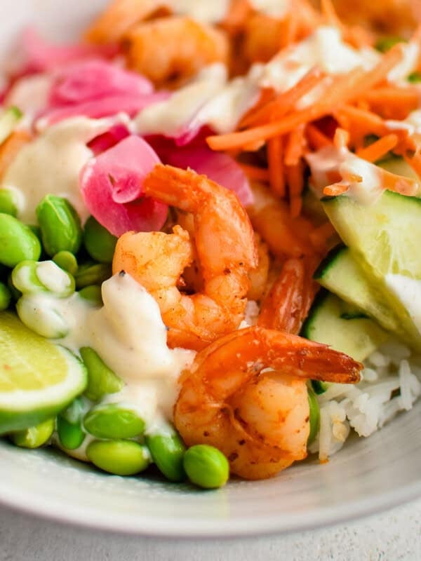 photo of shrimp rice bowls with veggies and sauce