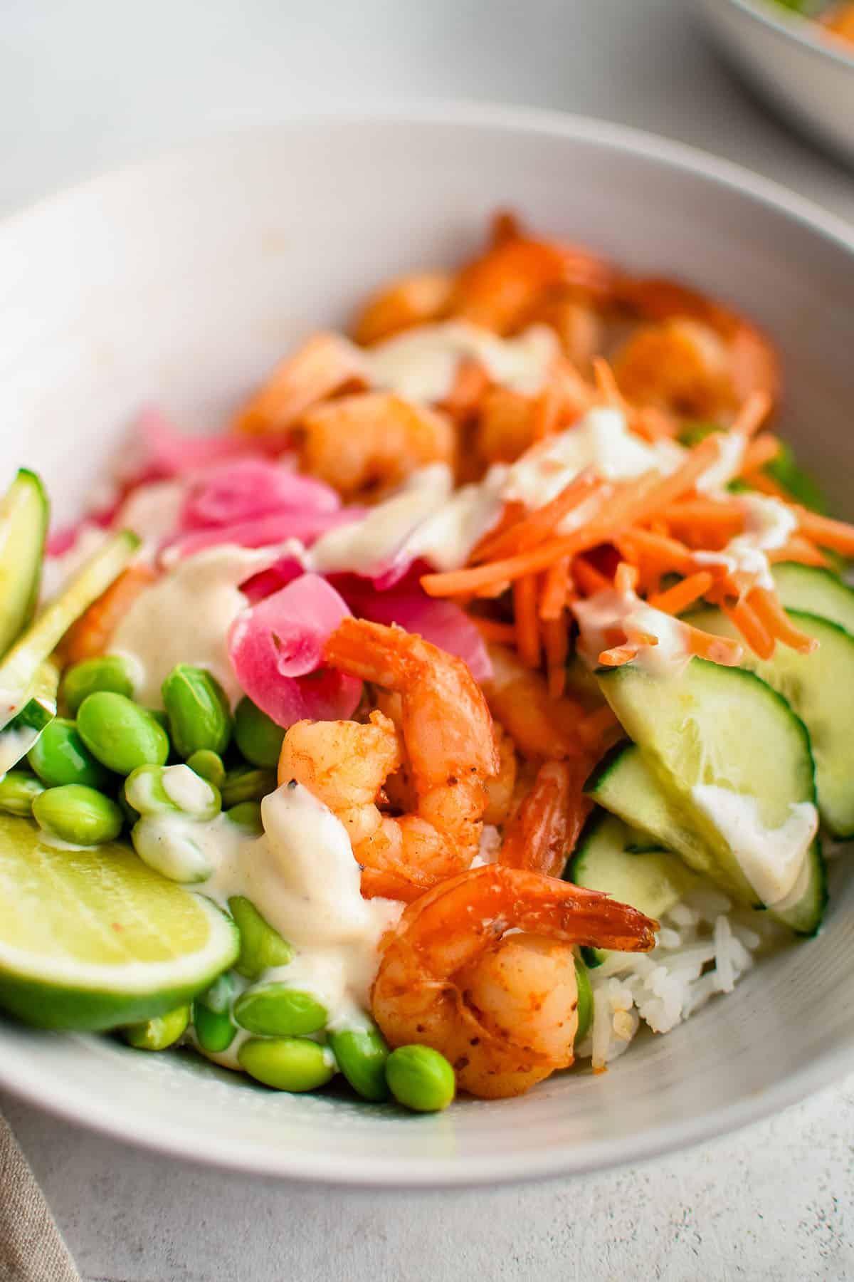 shrimp rice bowls with veggies and sauce 