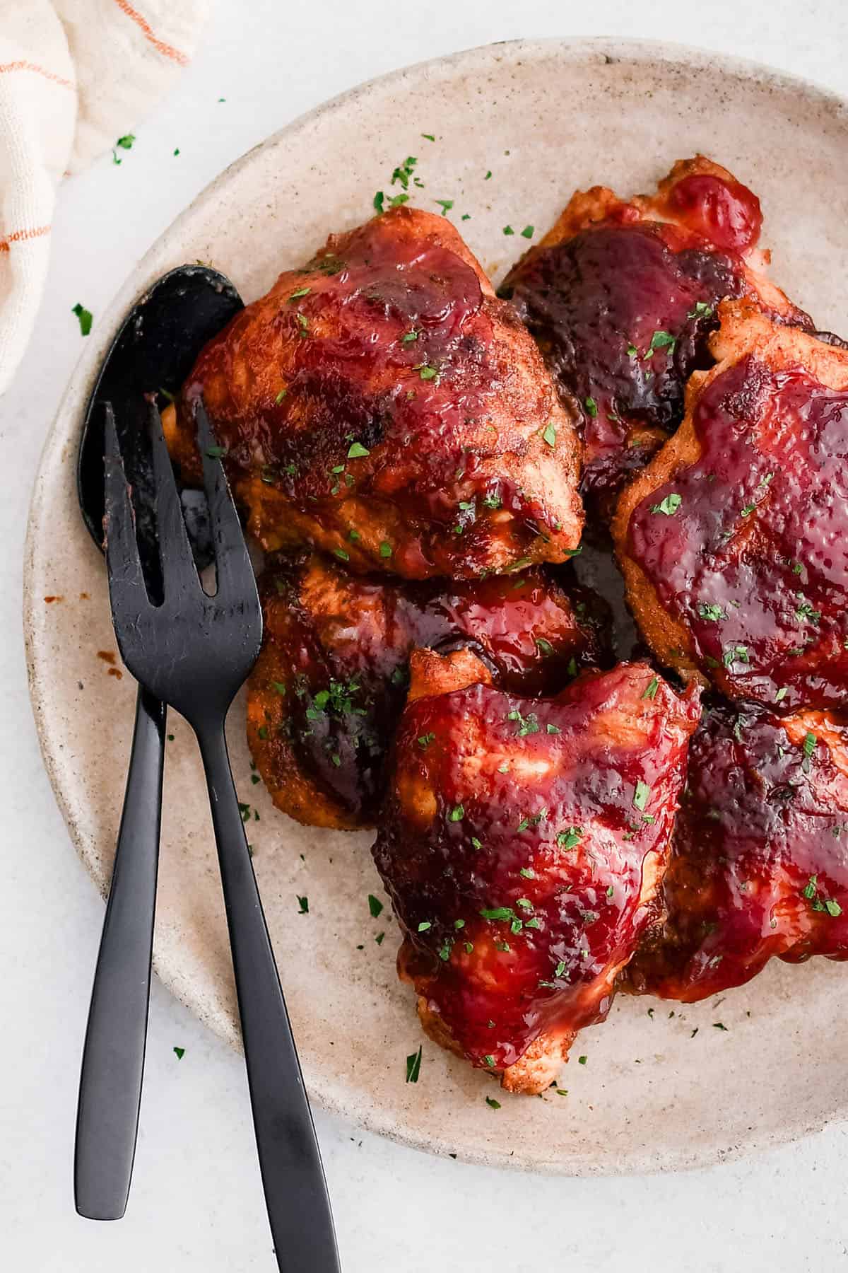 bbq baked chicken thighs on a plate