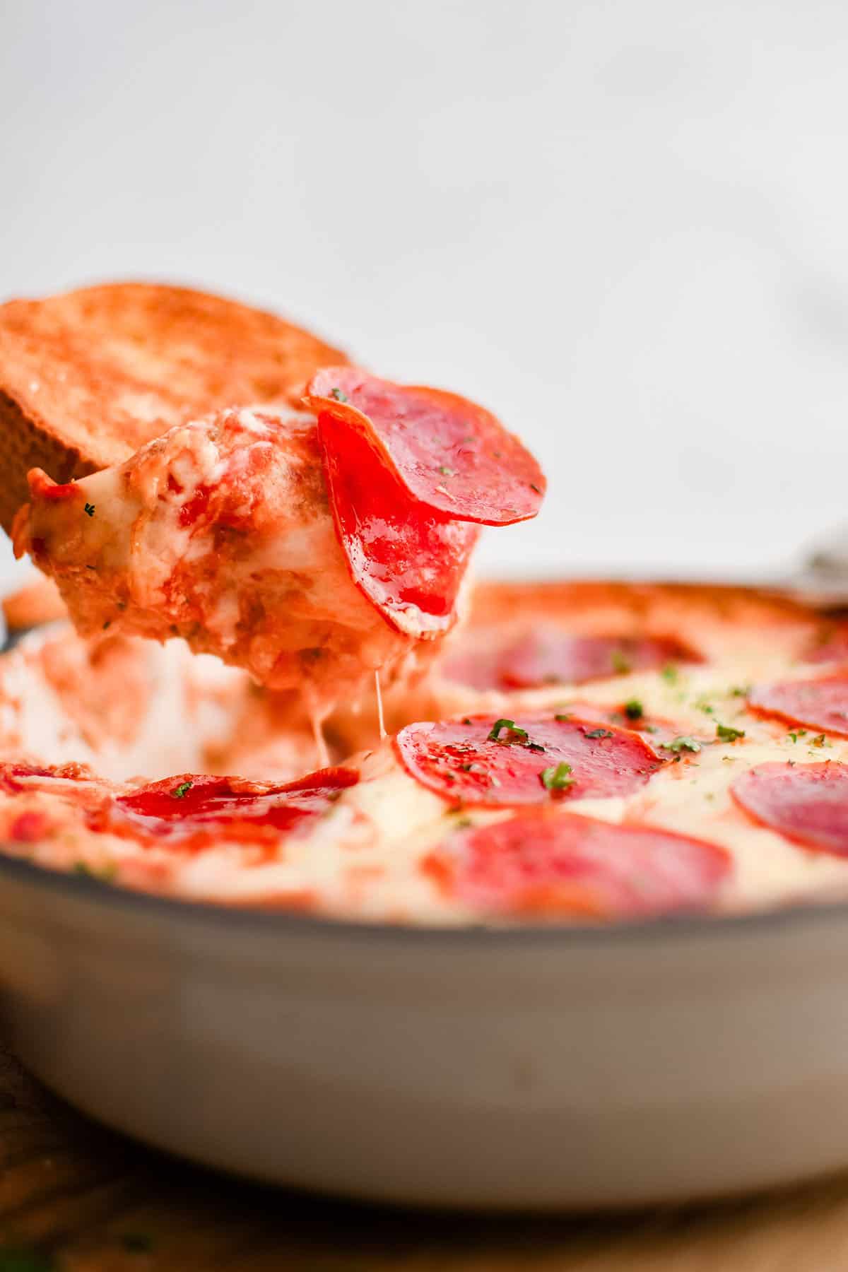 photo of pizza dip on a slice of garlic bread