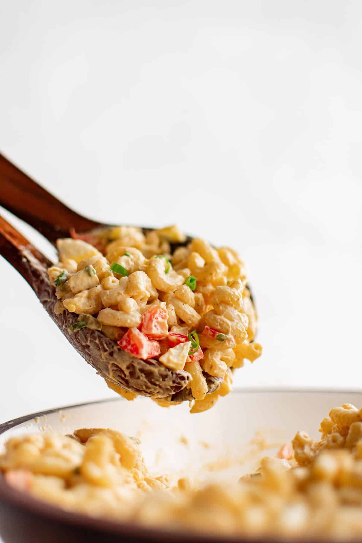 photo of macaroni salad in a serving spoon