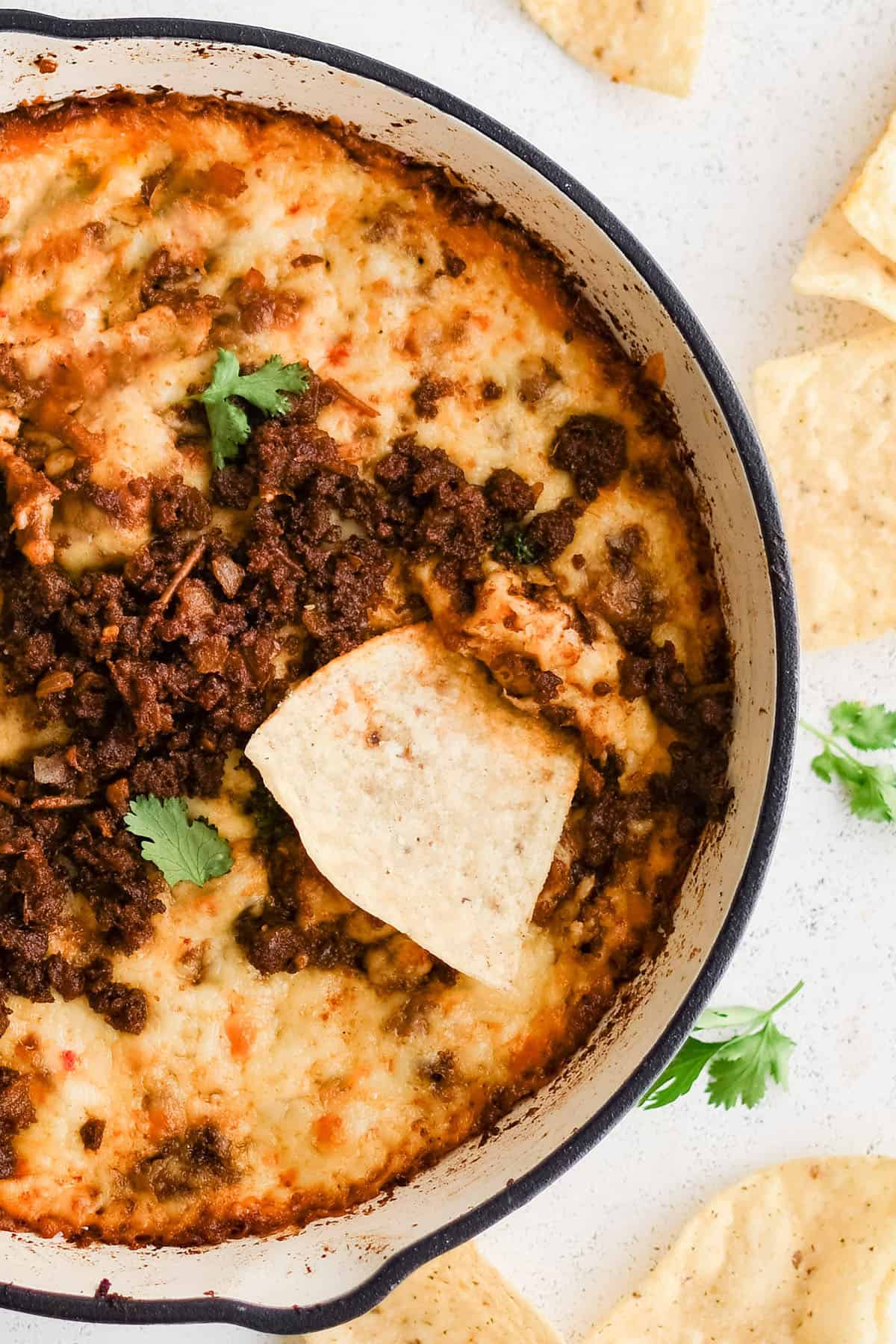 queso fundido in a cast iron skillet