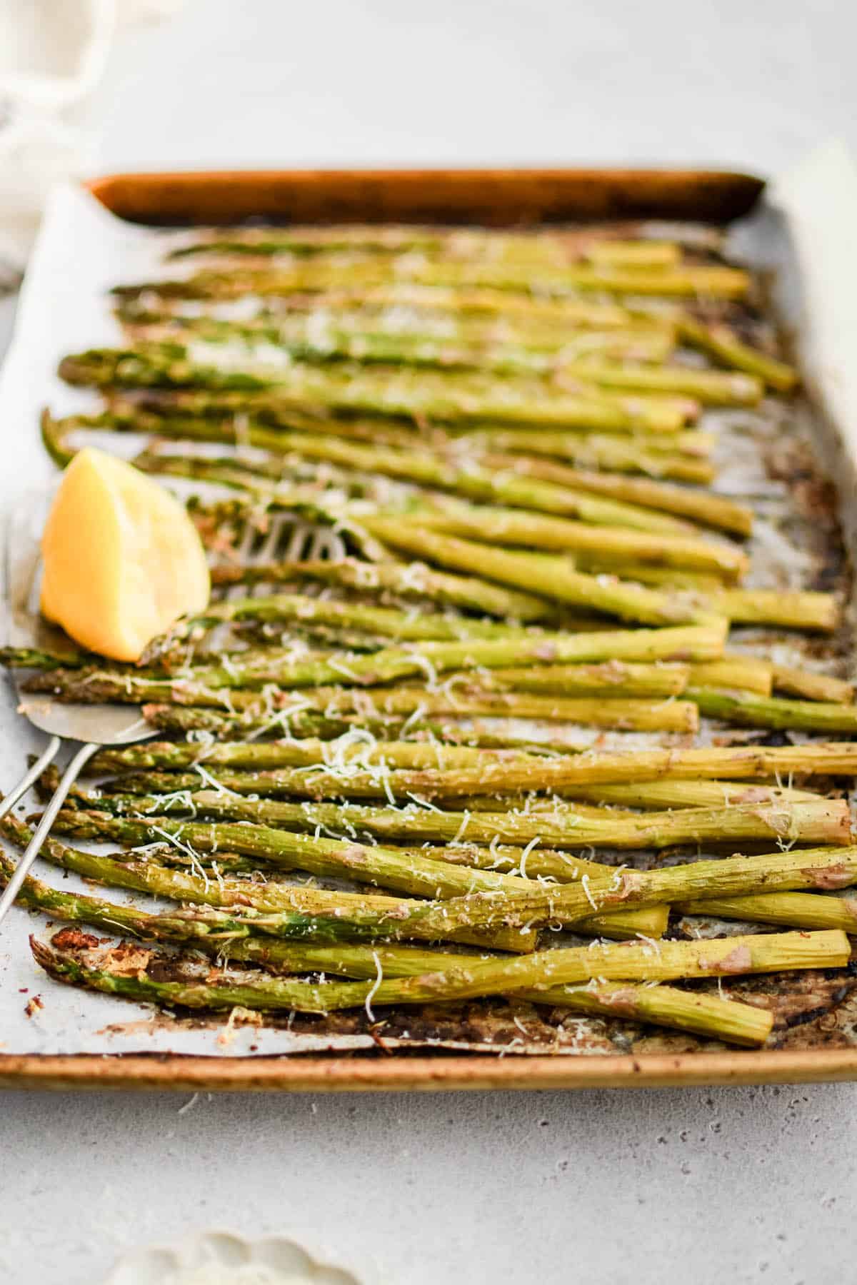roasted asparagus on a baking sheet