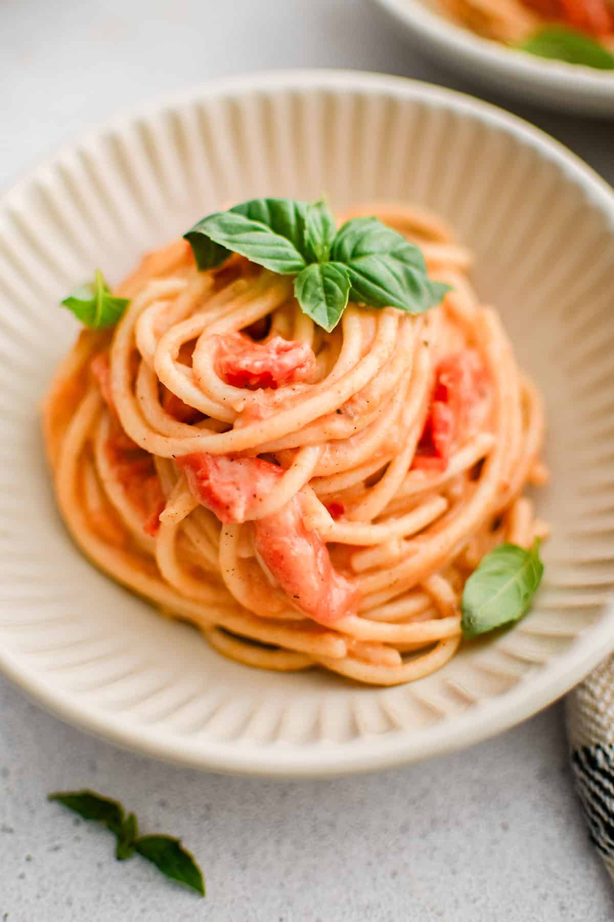 cheesy tomato garlic pasta in a bowl