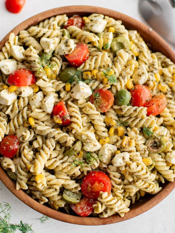photo of pasta salad with pesto in a serving bowl