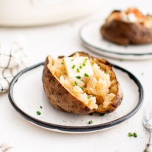 photo of a baked potato made in the slow cooker on a plate