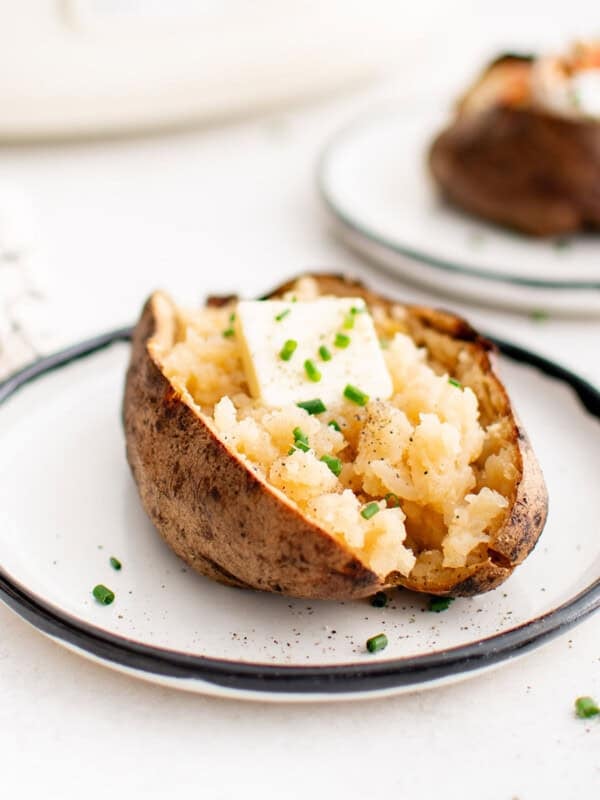 photo of a baked potato made in the slow cooker on a plate
