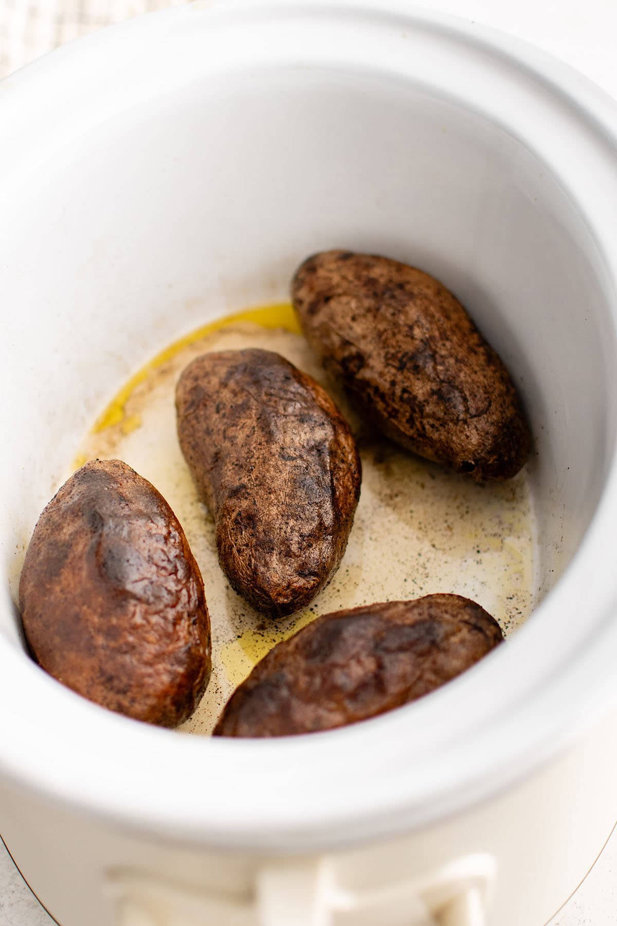 photo of baked potatoes in the slow cooker