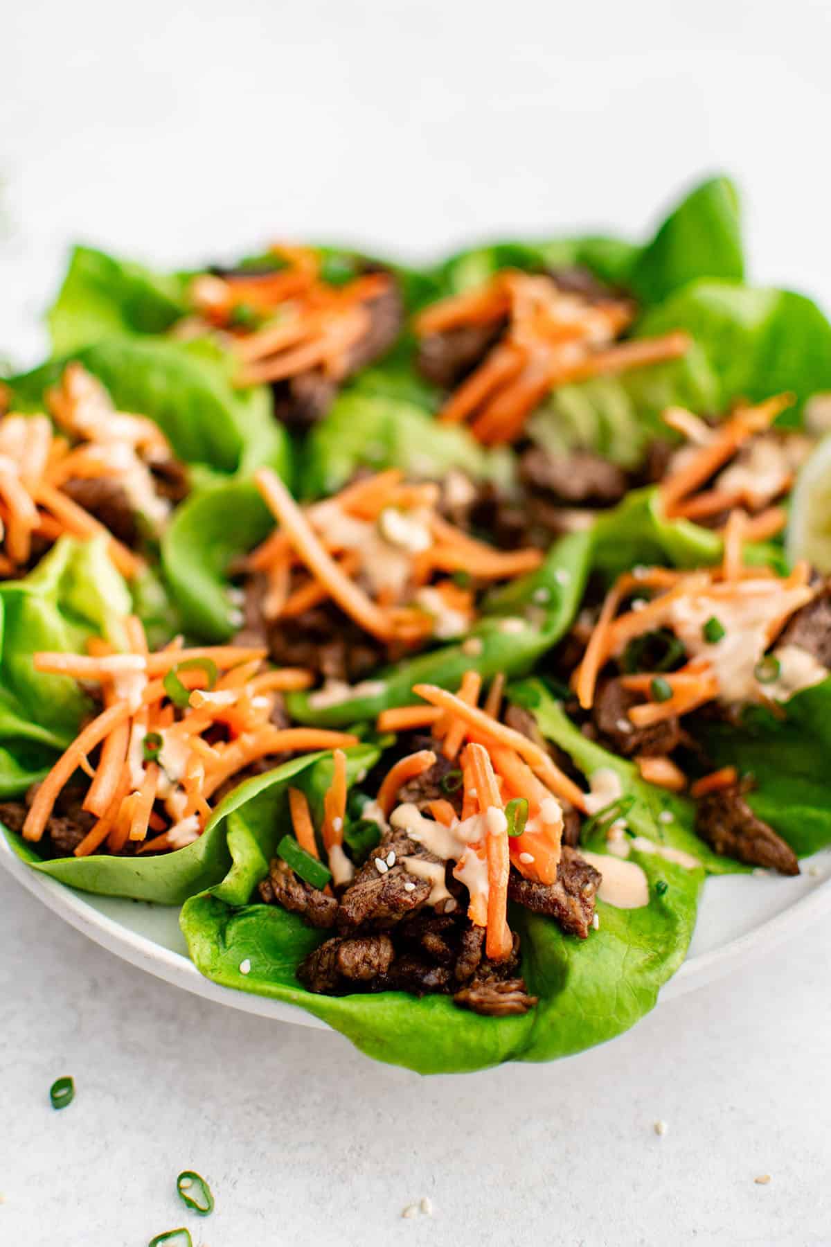 photo of sesame garlic steak lettuce wraps on a plate