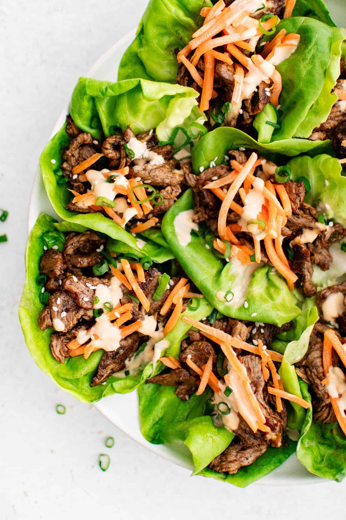 steak lettuce wraps assembled on a plate