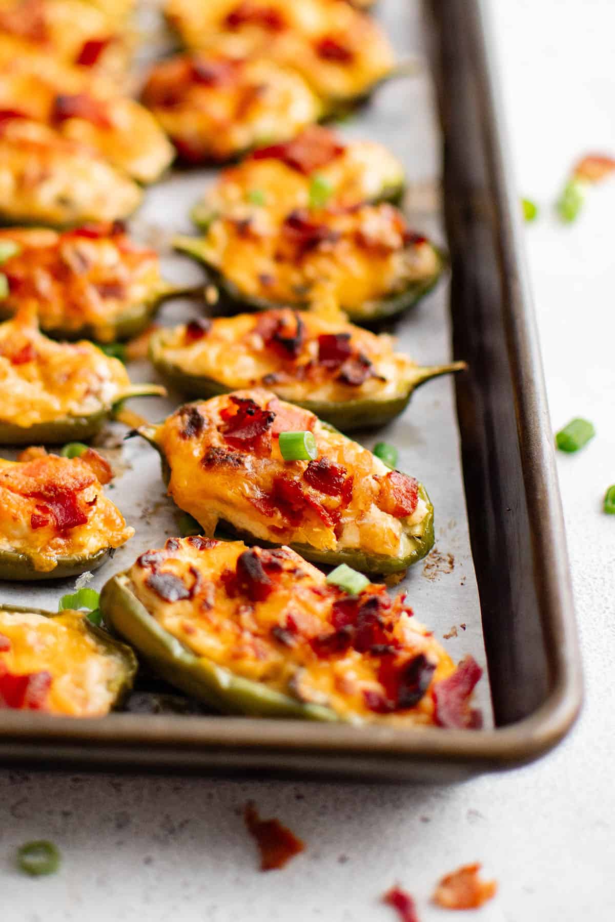jalapeno poppers on a baking sheet
