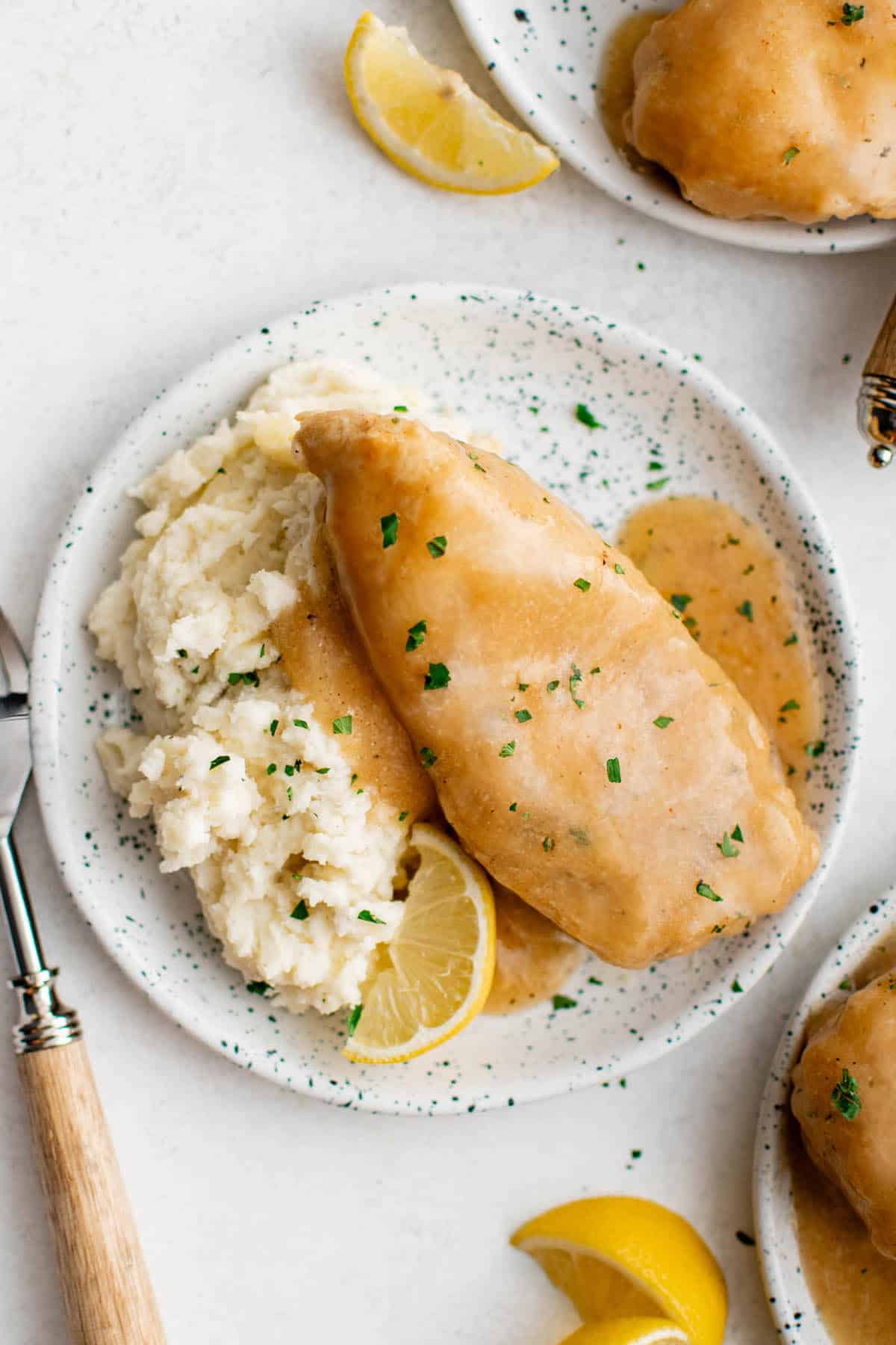 crockpot lemon pepper butter chicken on a plate