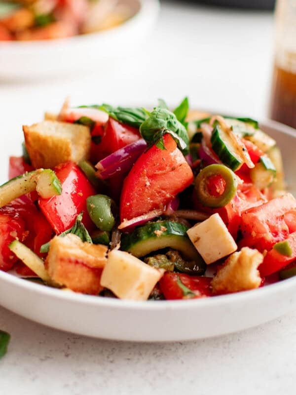 photo of panzanella salad on a white plate
