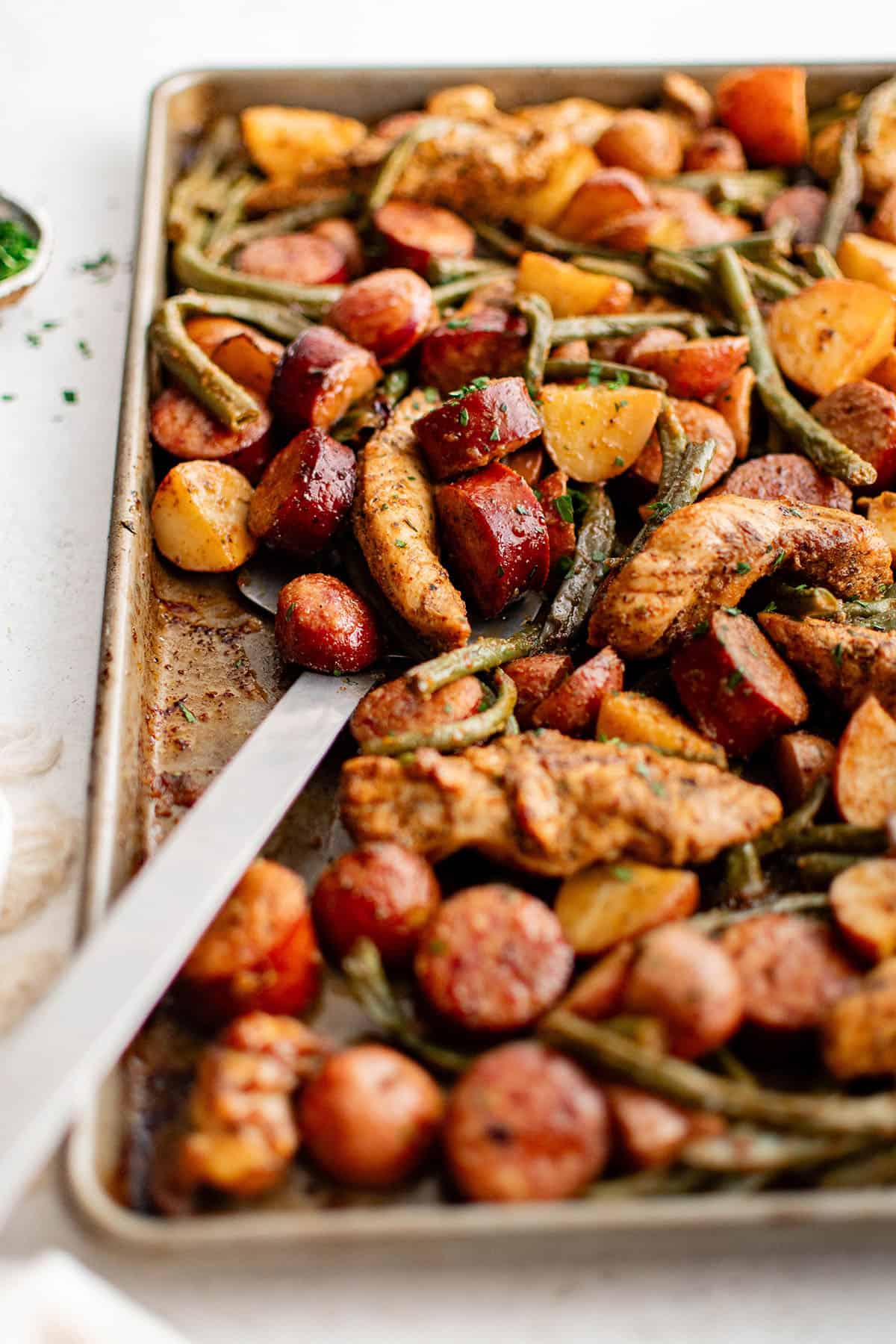 sheet pan dinner with chicken, sausage, and vegetables