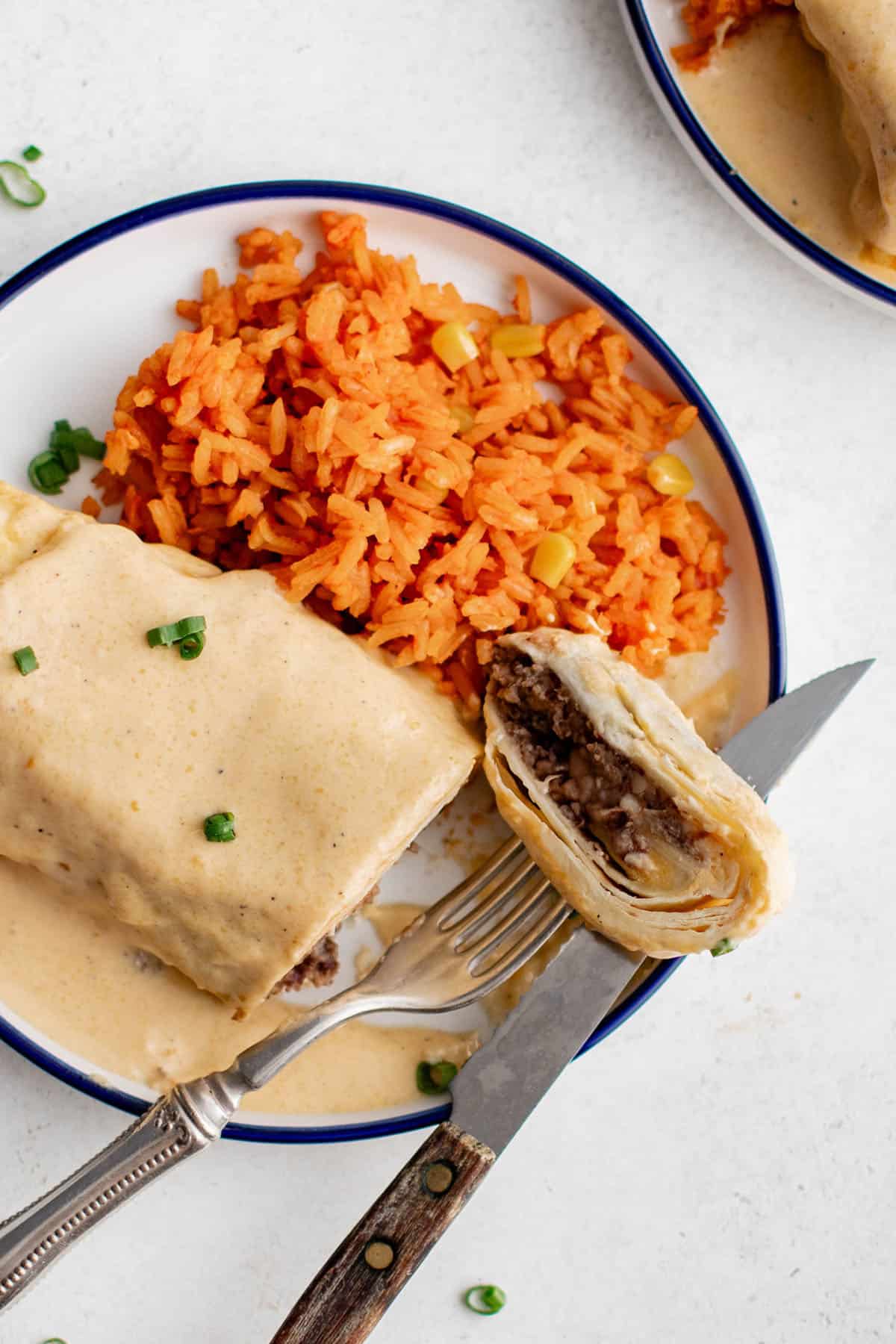 smothered bean & cheese burrito on a plate