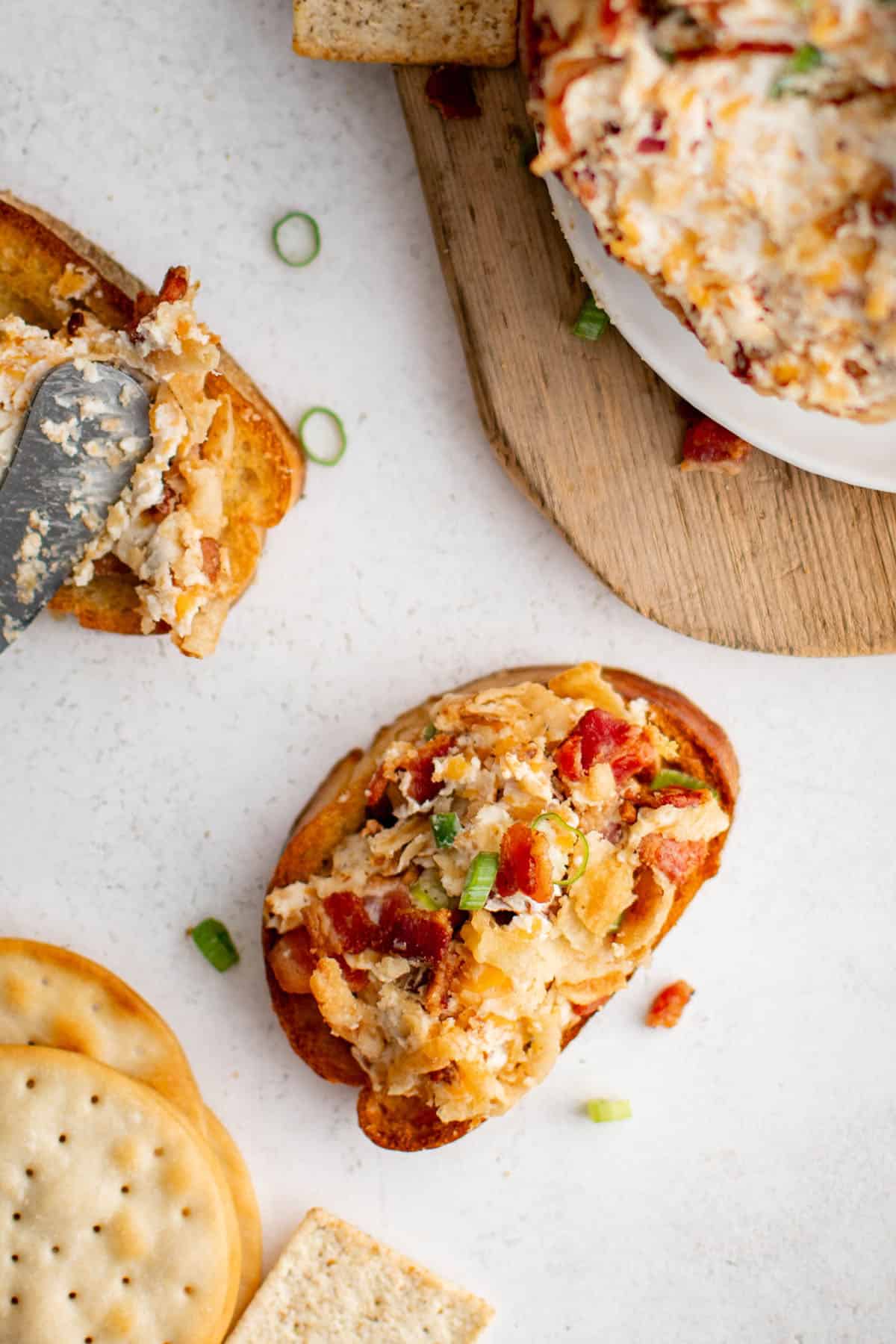 a serving of French onion cheeseball on a piece of toasted bread