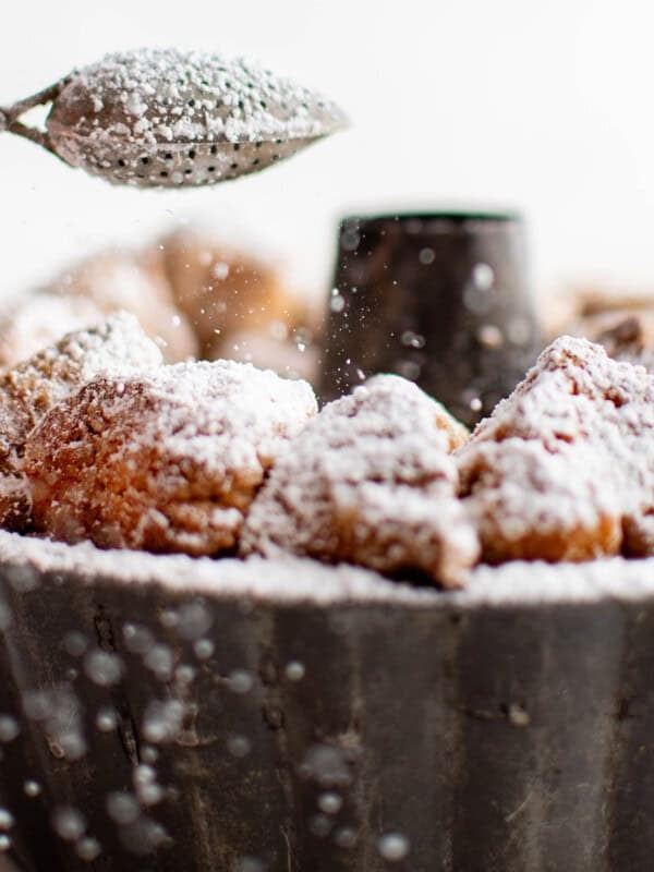 picture of monkey bread in a pan with powdered sugar