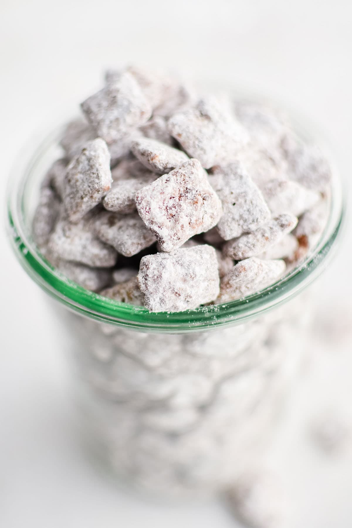 close up image of puppy chow in a serving glass