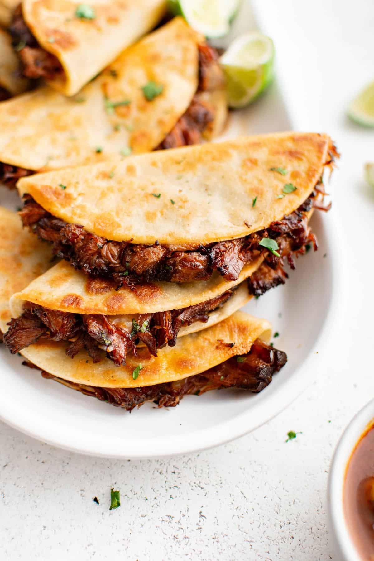 mississippi beef tacos stacked on a plate