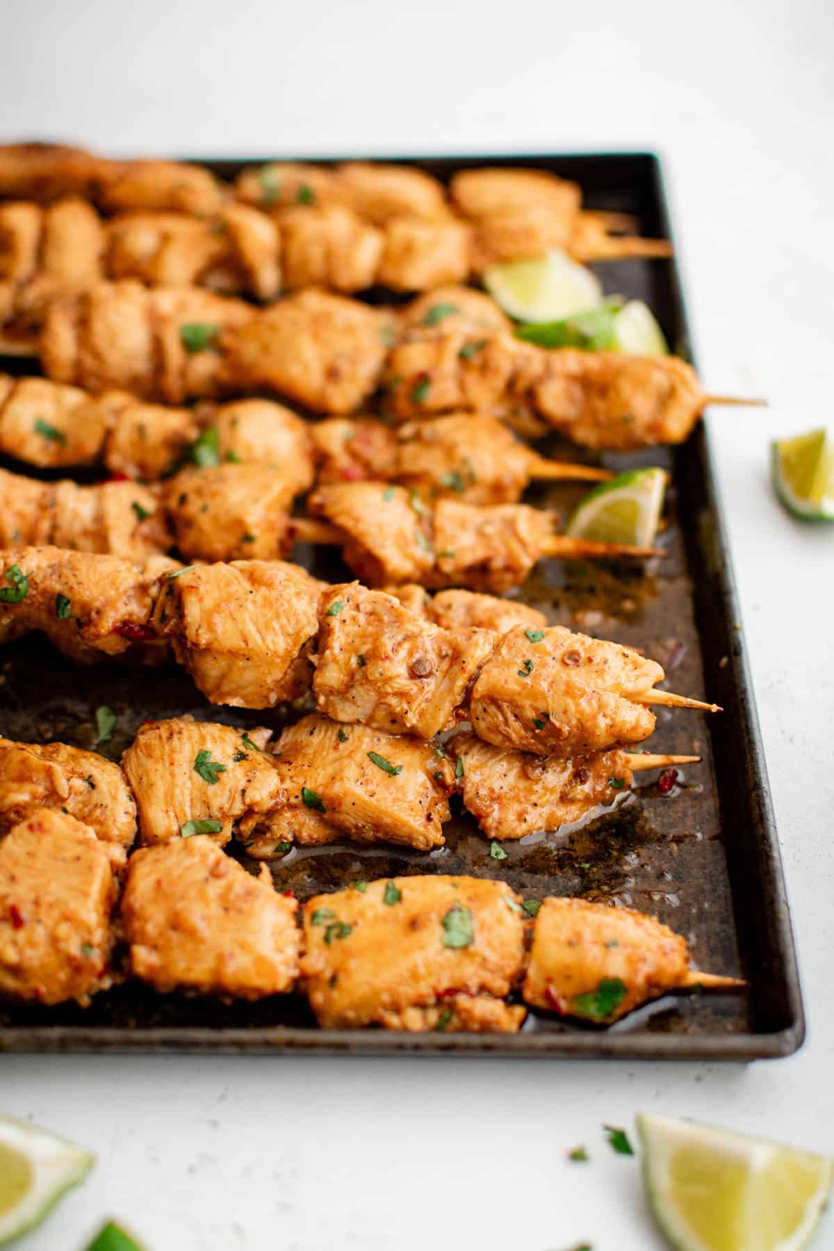 honey chipotle chicken kabobs on a baking sheet