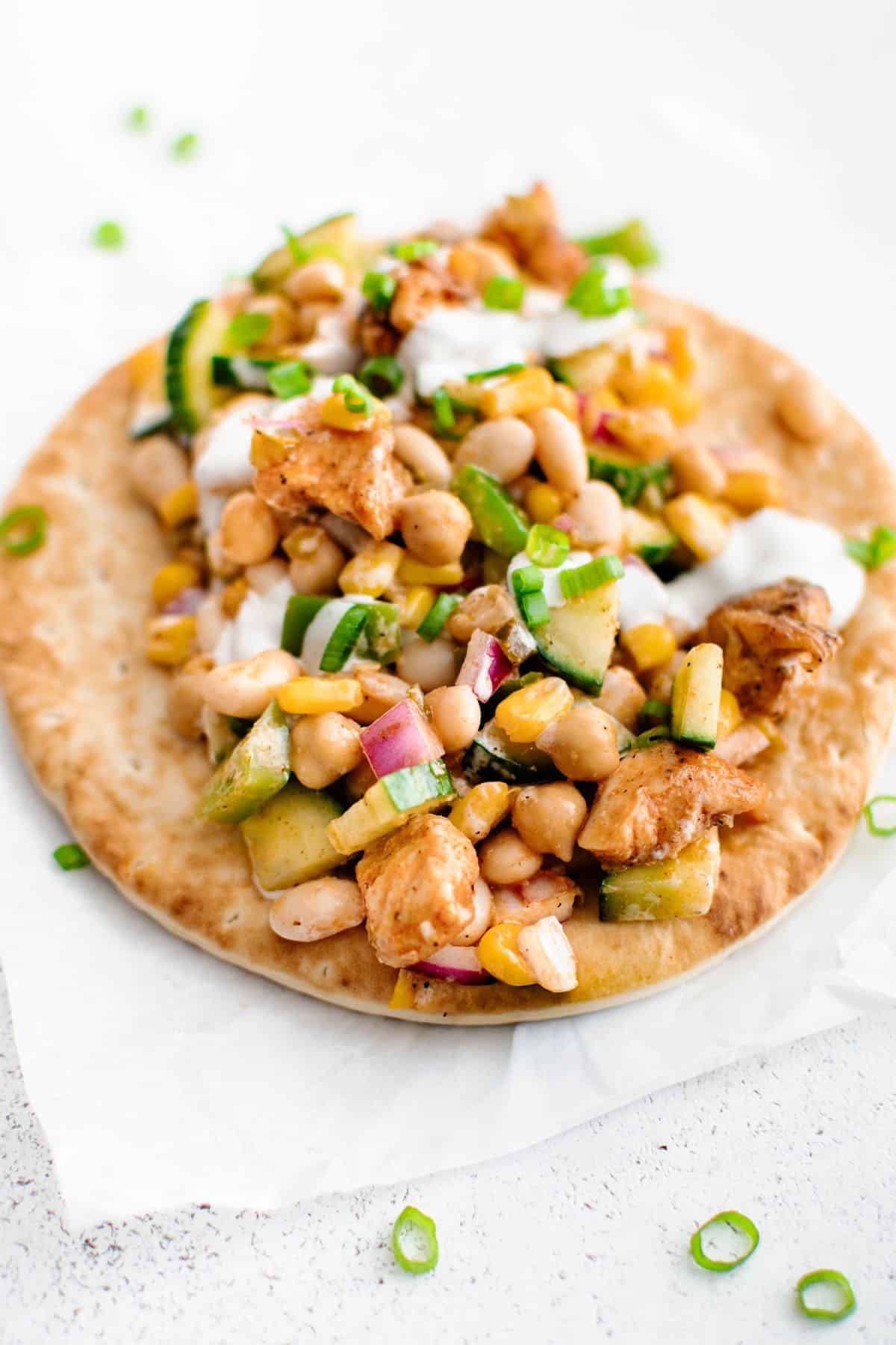 Buffalo Chicken Bean Salad on top of a flatbread