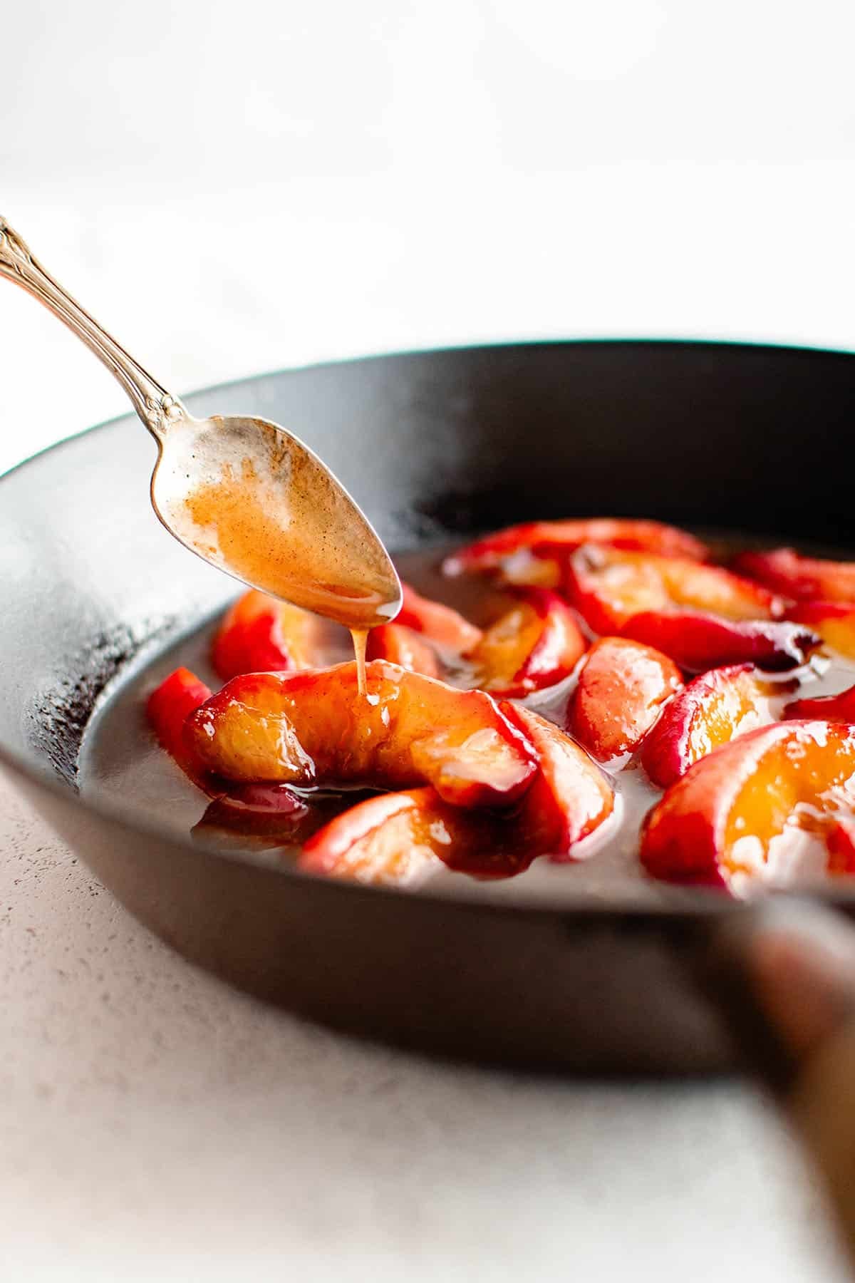 photo of caramelized peaches in a pan