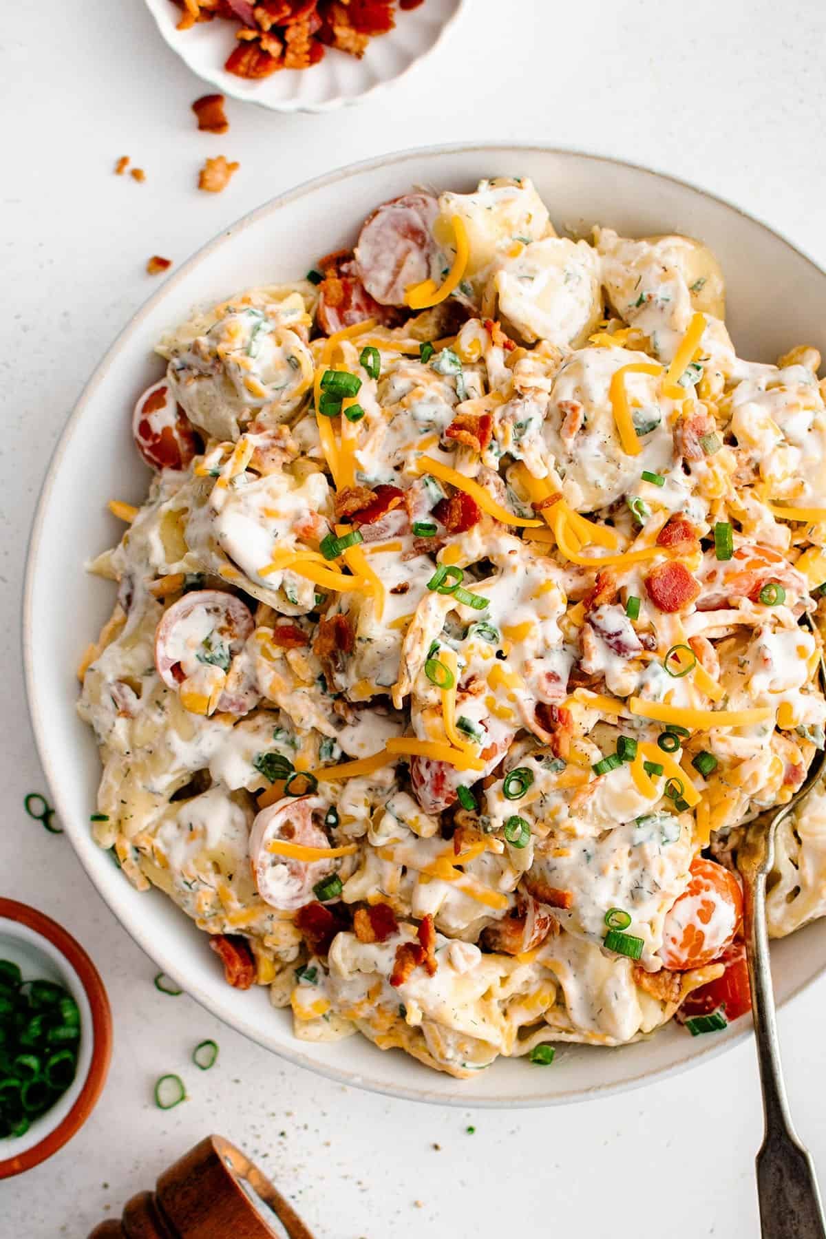 ranch tortellini salad in a large white serving bowl