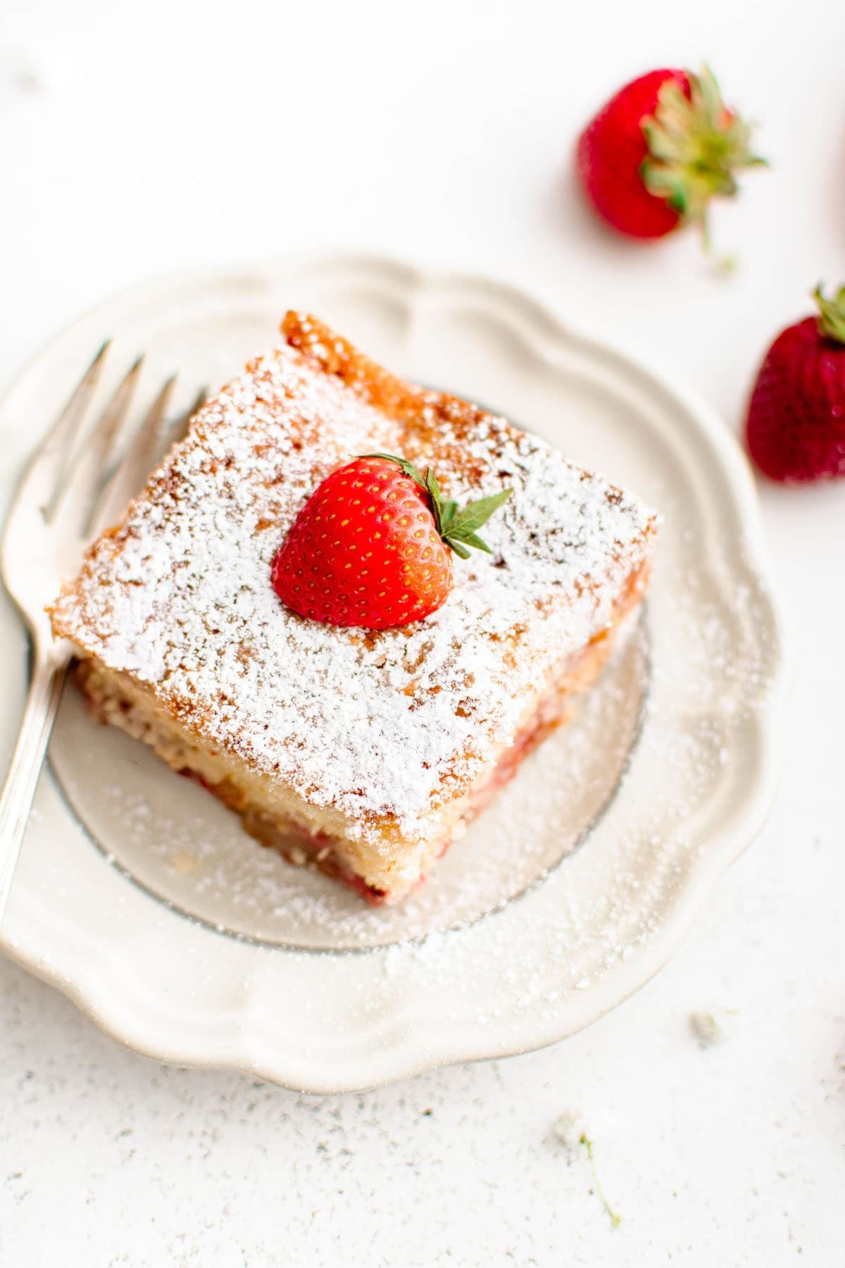photo of strawberry cake on a white plate