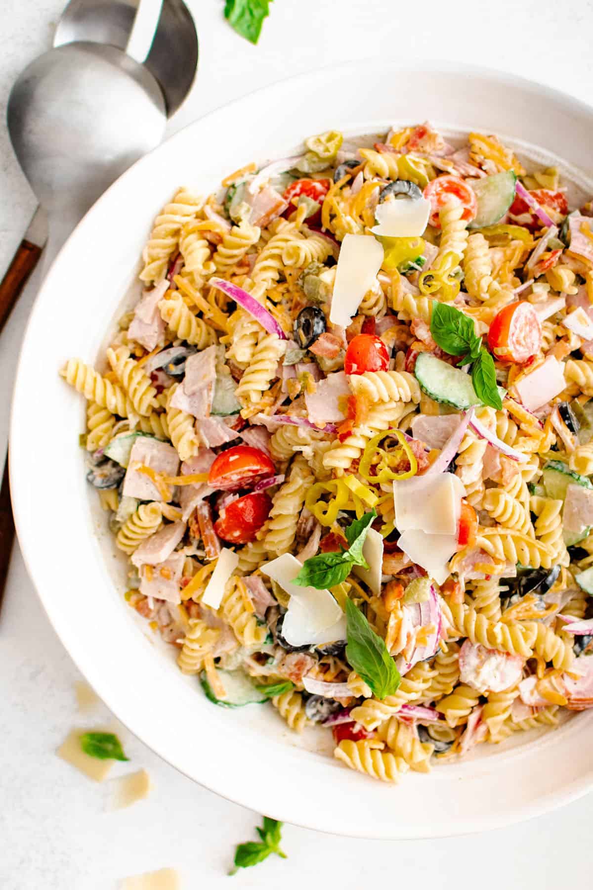 overhead photograph of loaded pasta salad in a serving bowl