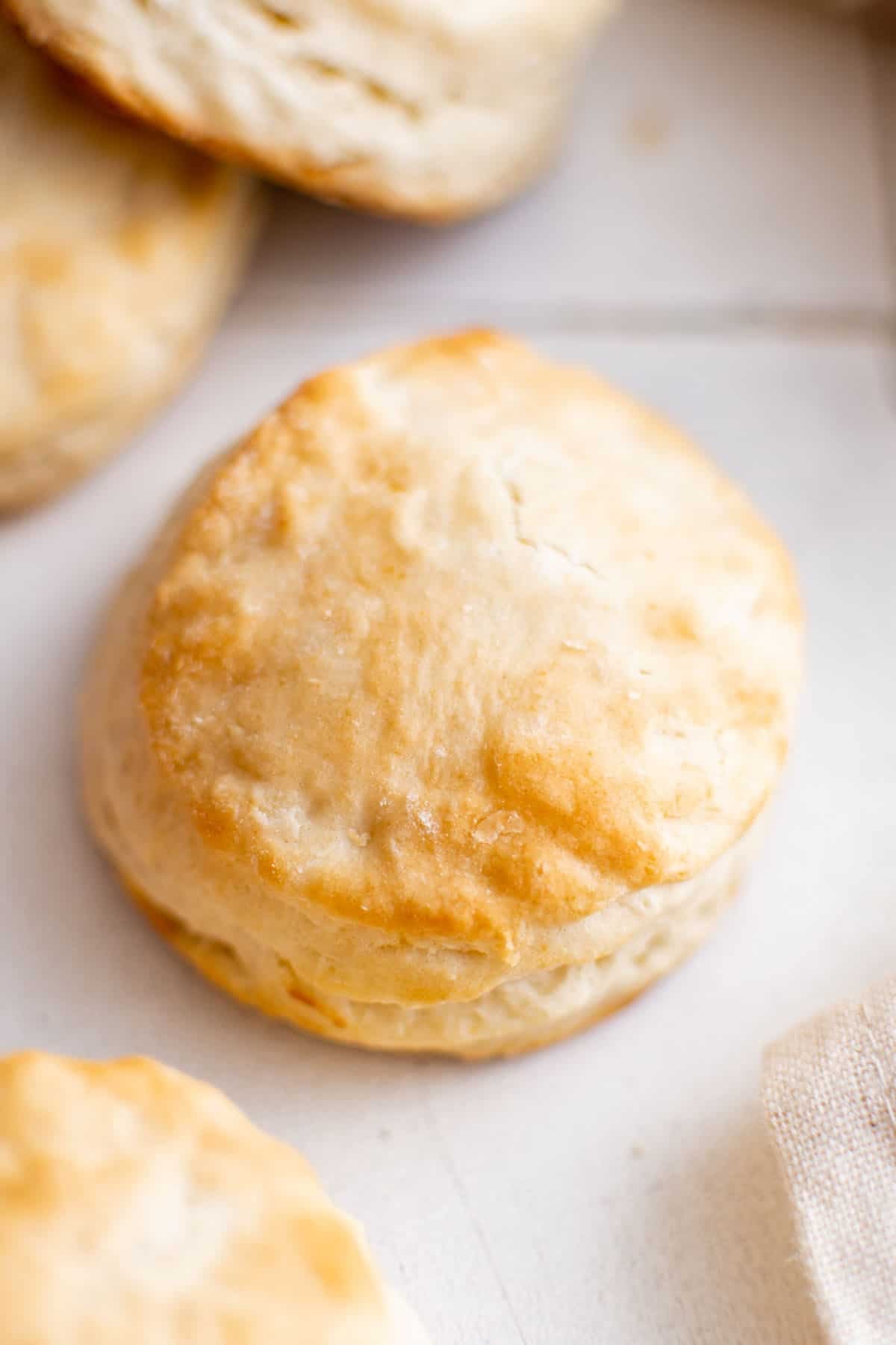 close up picture of a 7 up biscuit. the golden brown color and rich texture are strikingly visible